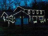 This year I added two rows of lights along the eastern roof line of the garage and the house, visible here in the upper left side of the photograph.