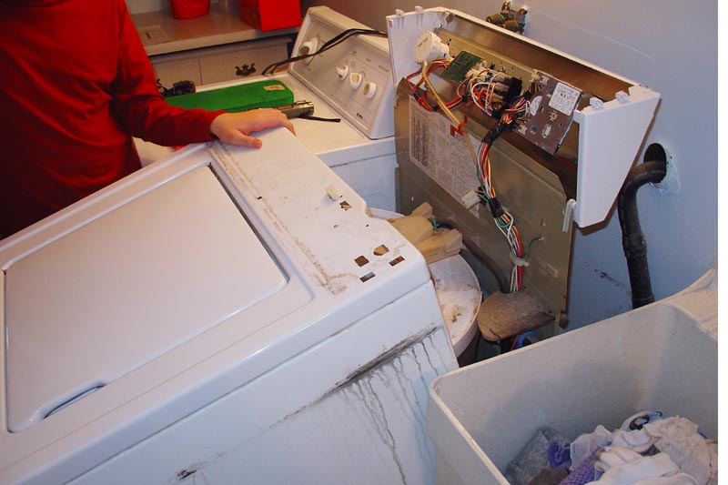 How do you remove the back of a Kenmore Series 90 dryer?